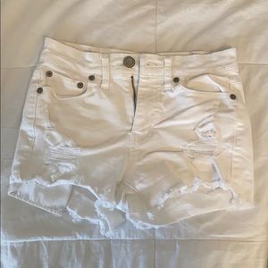 white ripped denim shorts